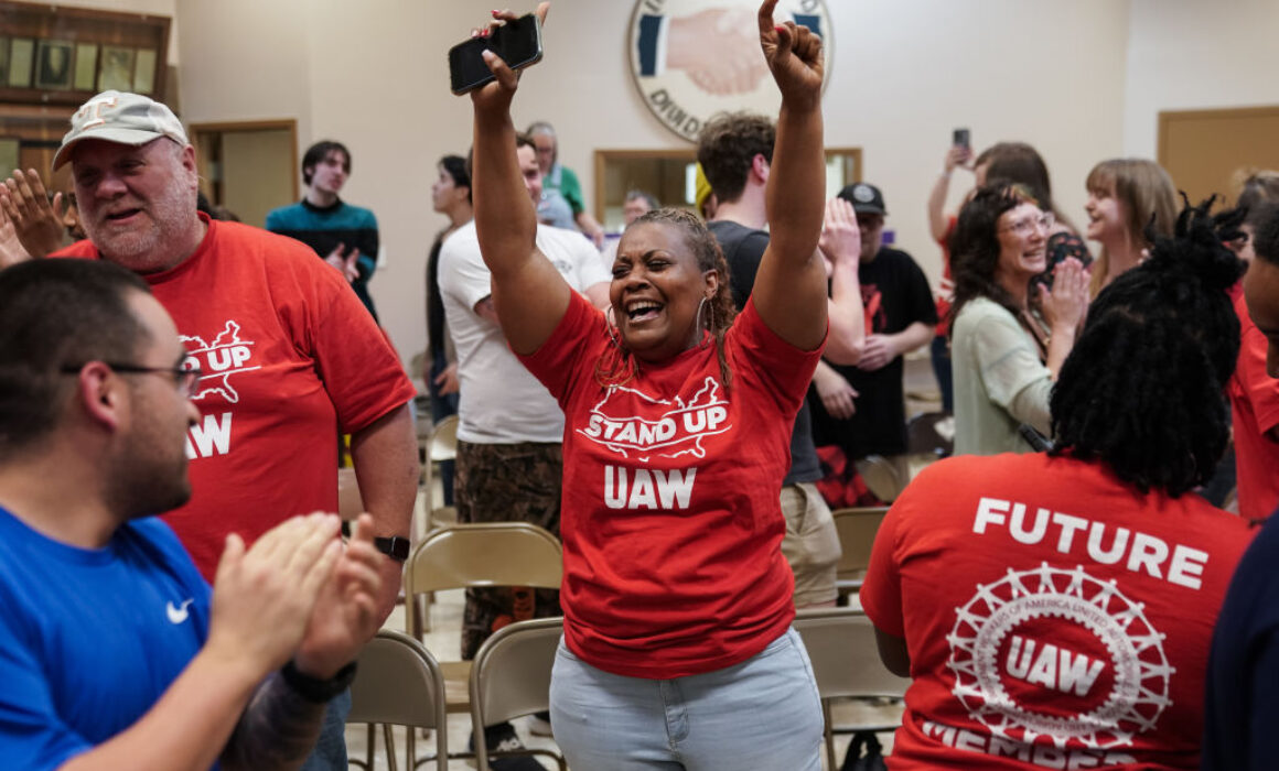 People celebrate after the United Auto Workers (UAW) received enough votes to form a union at a UAW vote watch party on April 19, 2024, in Chattanooga, Tennessee.